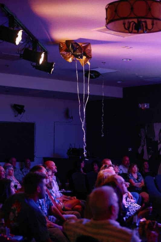 Celebratory balloons float above the audience during The Rat Pack is Back’s 25th anniver ...