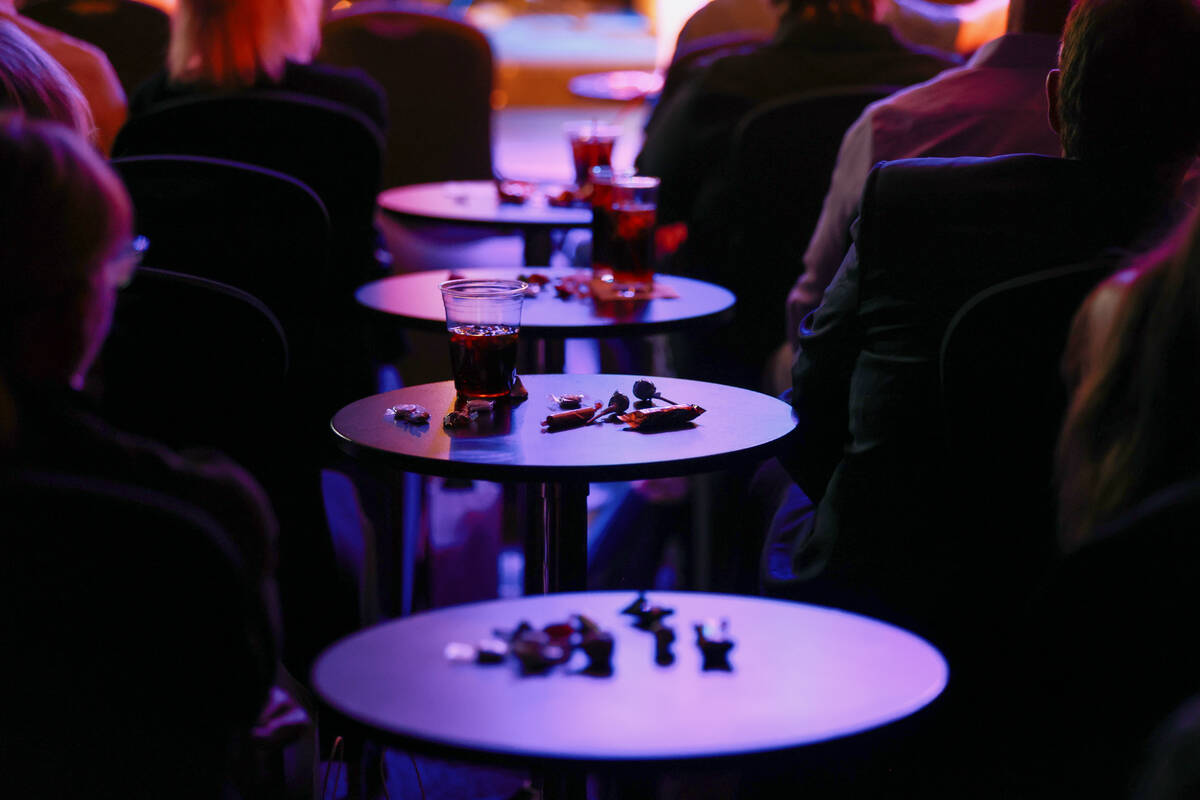 Candy and drinks sit on guests’ tables during The Rat Pack is Back’s 25th anniver ...