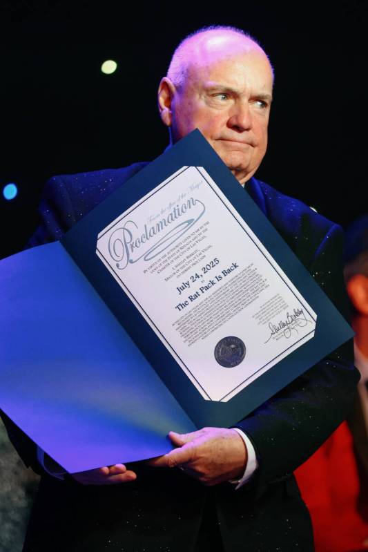 Producer and writer Dick Feeney shows the audience an official proclamation signed by Las Vegas ...