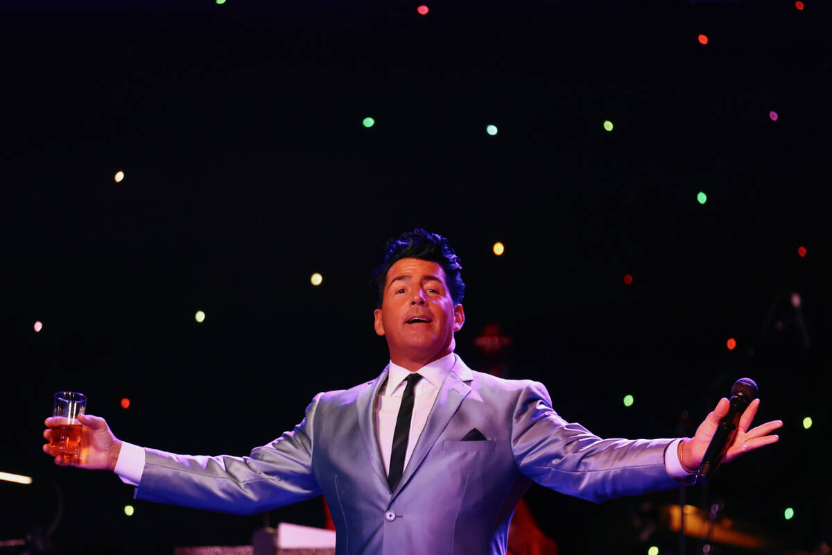 Drew Anthony sings as Dean Martin during The Rat Pack is Back’s 25th anniversary show at ...