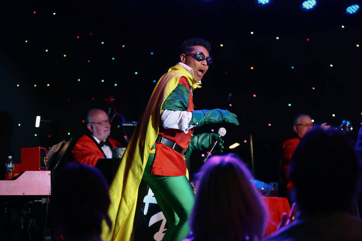 Kyle Diamond enters the stage dressed as Robin while performing in character as Sammy Davis Jr. ...