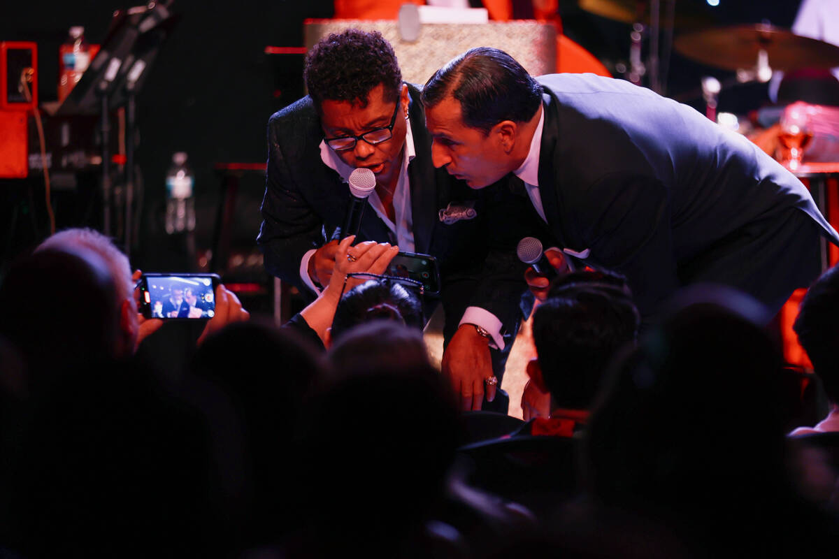Kyle Diamond and Chris Jason sing for audience members’ phone cameras in the front row a ...