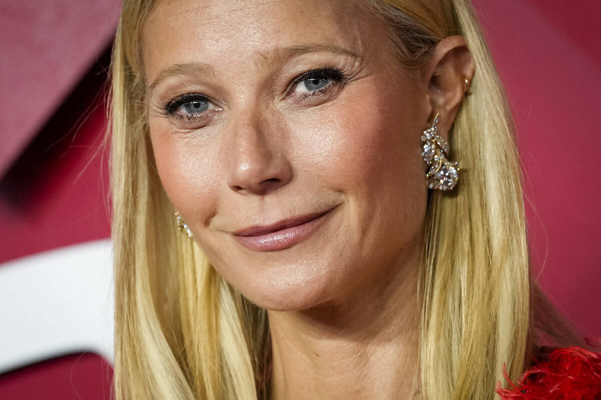 Gwyneth Paltrow poses for photographers upon arrival at the British Fashion Awards on Monday, D ...
