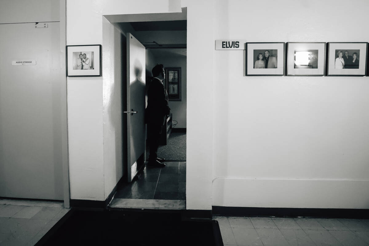 Travis Powell (out of frame), an Elvis tribute artist, is waited on as he gets ready before &#x ...