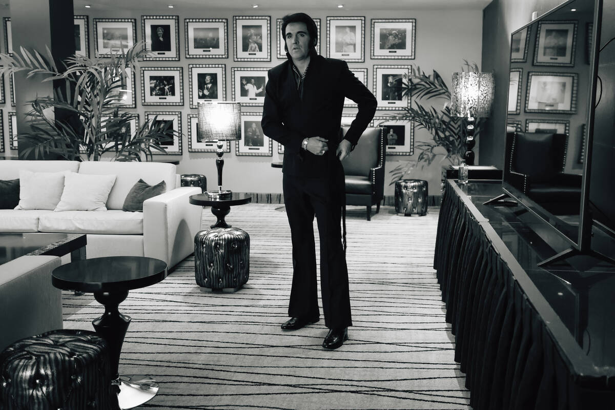 Travis Powell, an Elvis tribute artist, gets ready before performing in “1969 Live Conce ...
