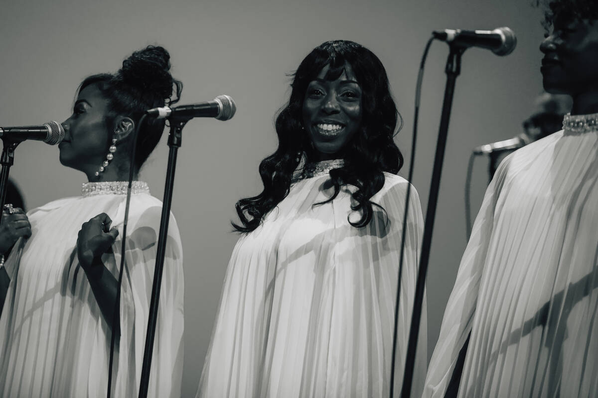 A background singer smiles during “1969 Live Concert: The King Returns” at the We ...