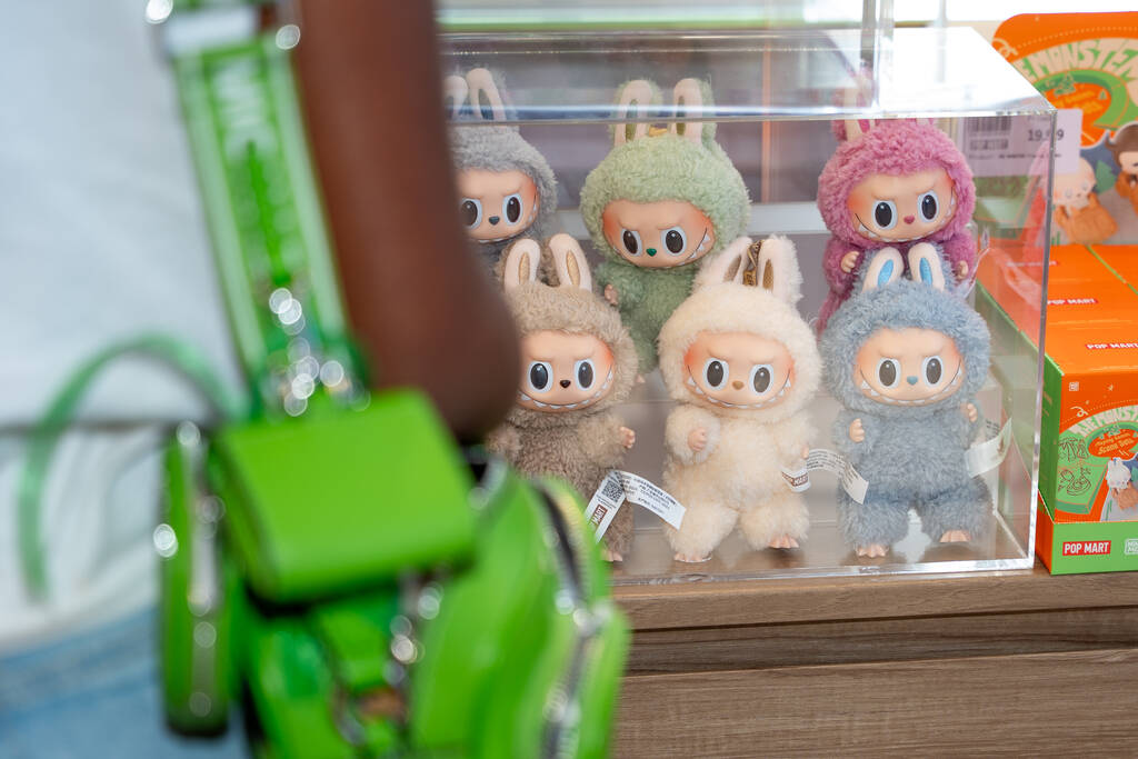 Customers look at Labubu dolls on display at Pop Mart’s new store in Las Vegas July 12, ...
