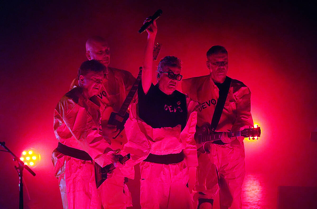 From left, Gerald Casale, Josh Hager, Mark Mothersbaugh and Bob Mothersbaugh of Devo perform at ...