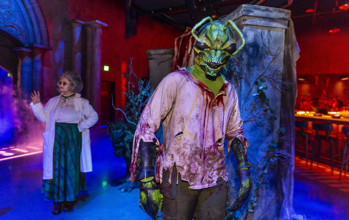 Characters move about within the Dead Storage area during a first look tour at Universal Horror ...