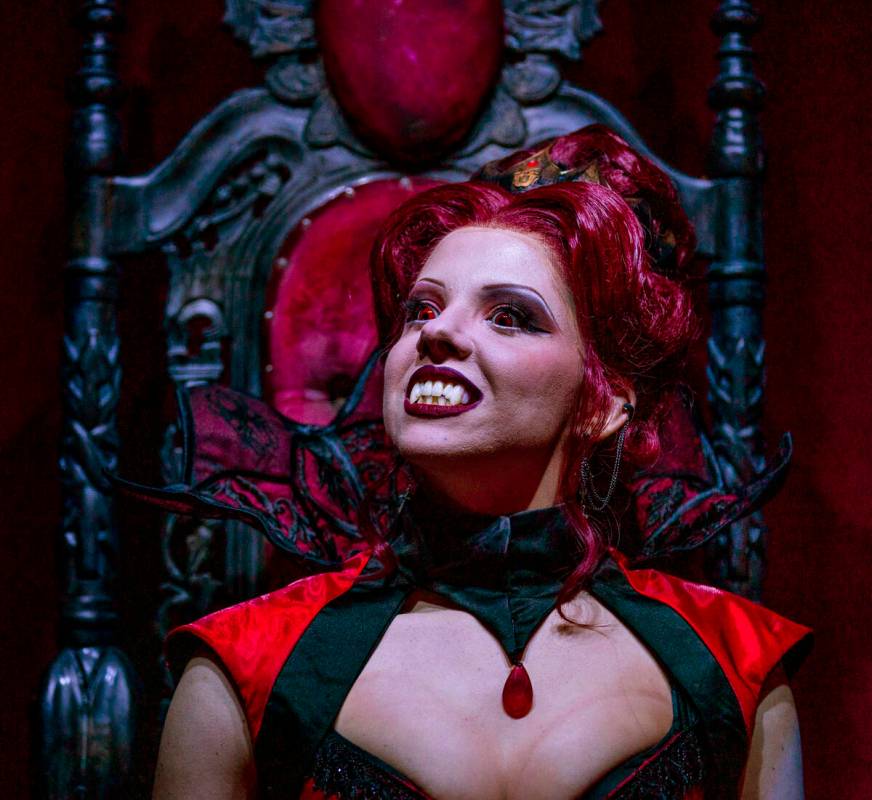 A mistress of the dark sits on her throne within the Dead Storage area during a first look tour ...