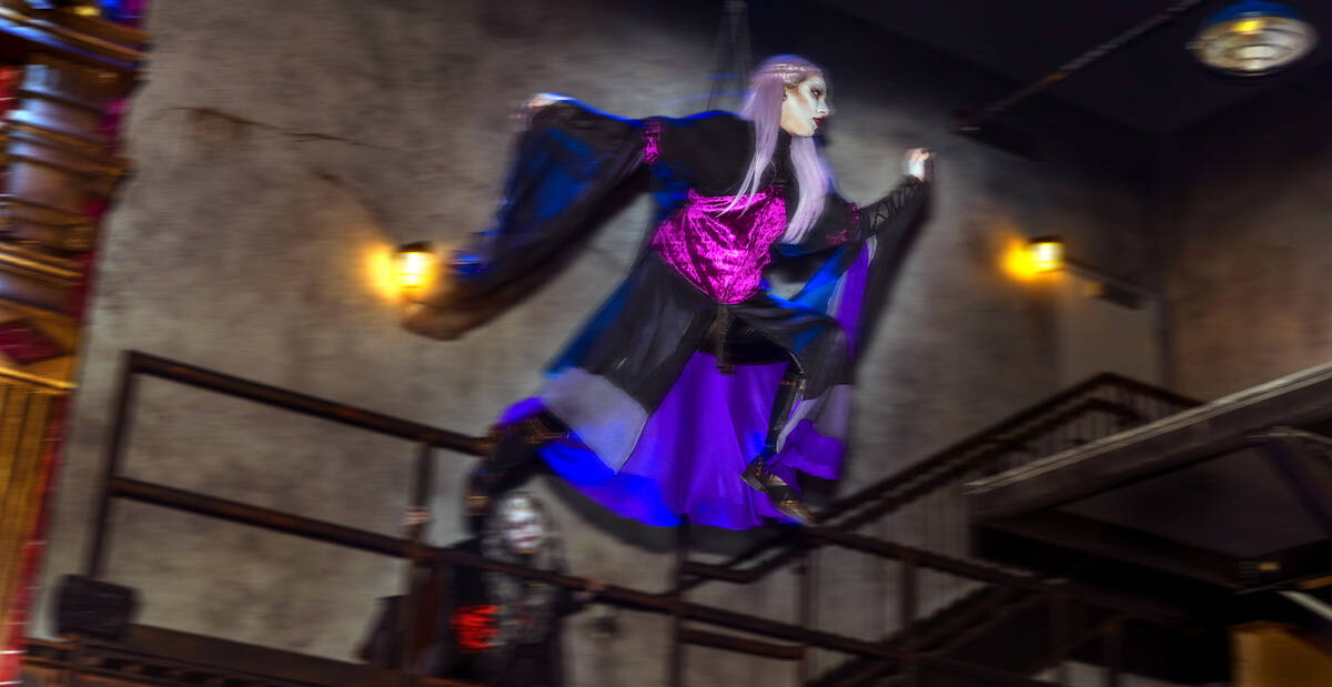 A witch flies above within the Dead Storage area during a first look tour at Universal Horror U ...