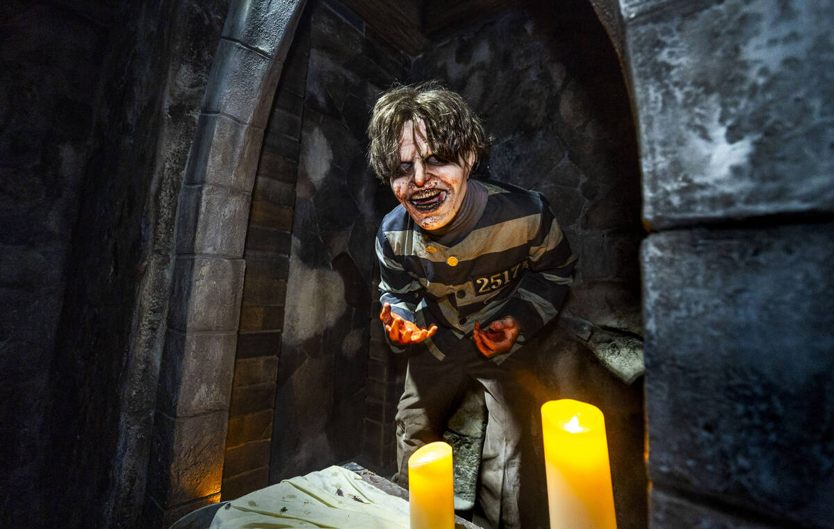 A demented prisoner pops out from a cave entrance within the Universal Monsters house during a ...