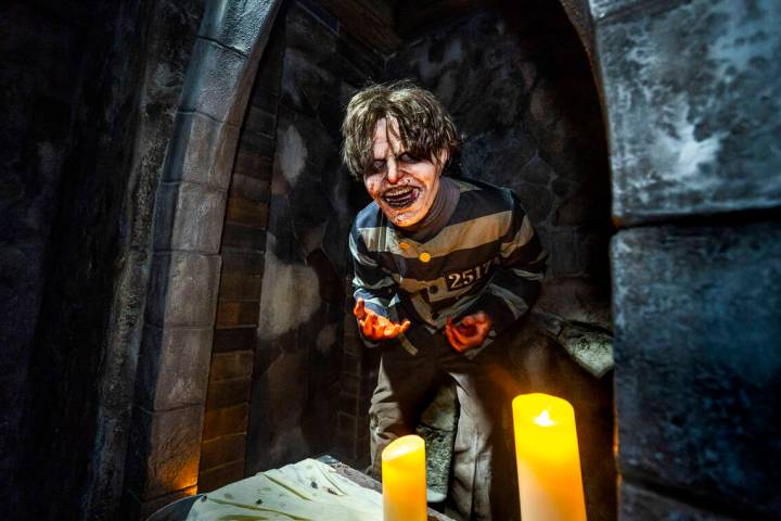 A demented prisoner pops out from a cave entrance within the Universal Monsters house during a ...