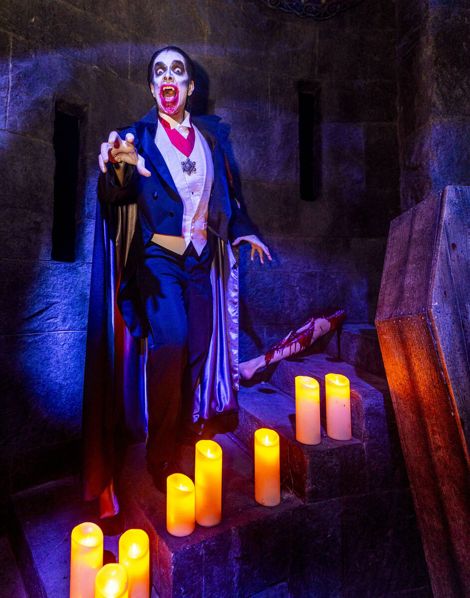 Dracula ascends candlelit stairs within the Universal Monsters house during a first look tour a ...