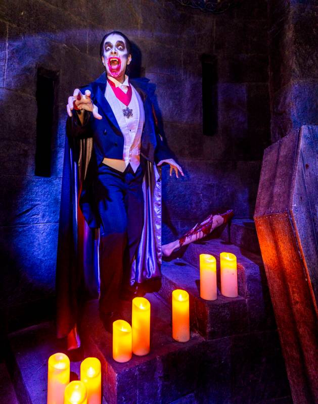 Dracula ascends candlelit stairs within the Universal Monsters house during a first look tour a ...