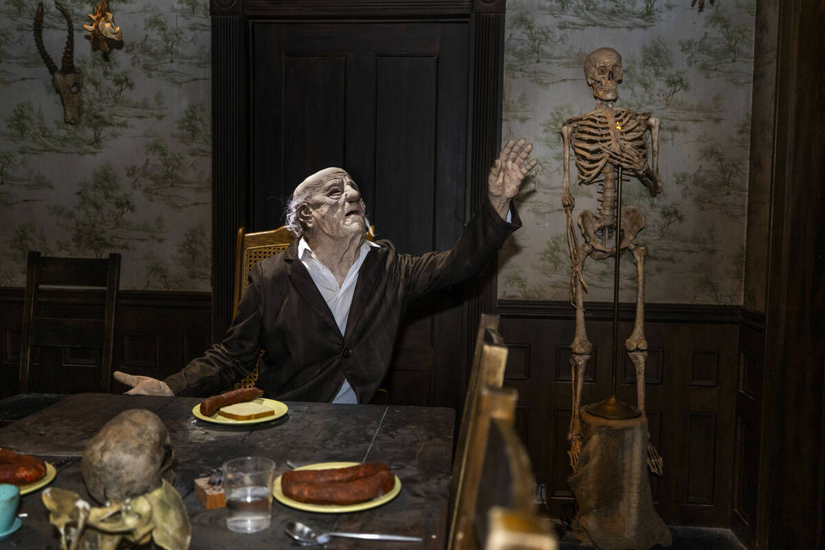 Grandfather enjoys a meal in a scene from The Texas Chainsaw Massacre, one of four haunted hous ...