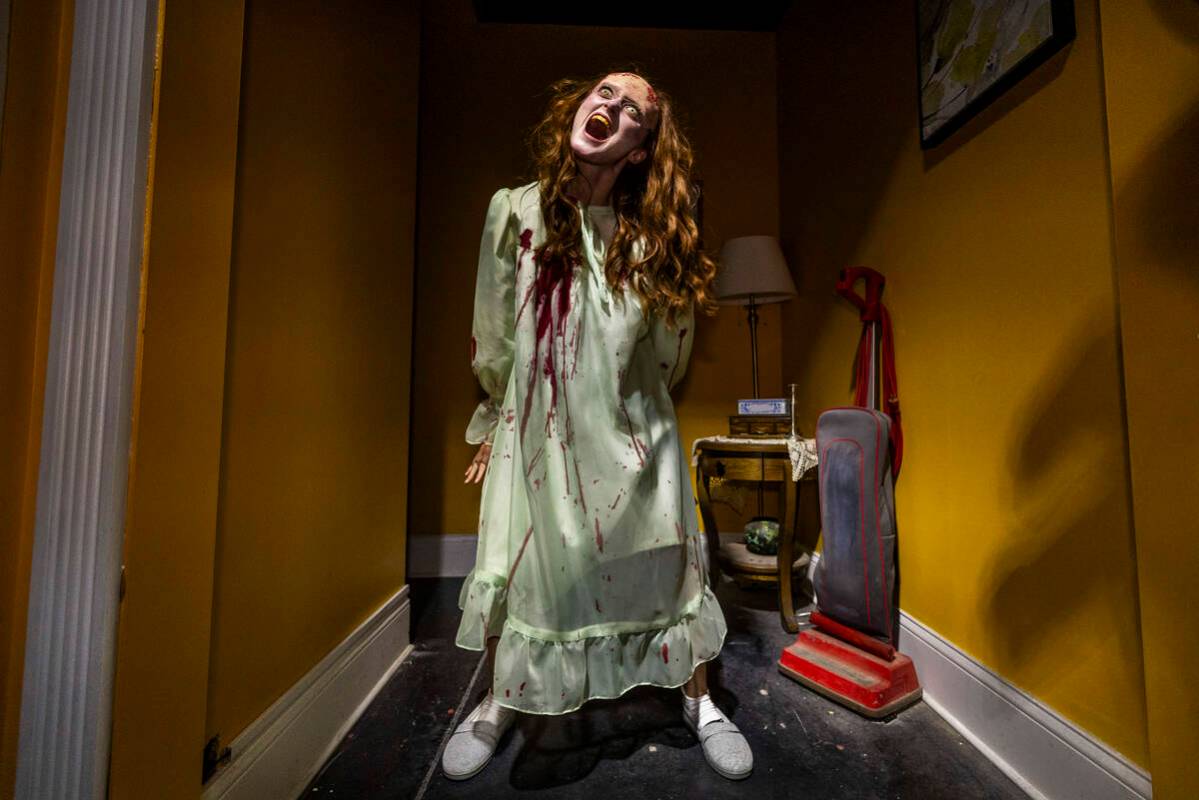 A possessed girl screams in a scene from Blumhouse's The Exorcist: Believer, one of four haunte ...
