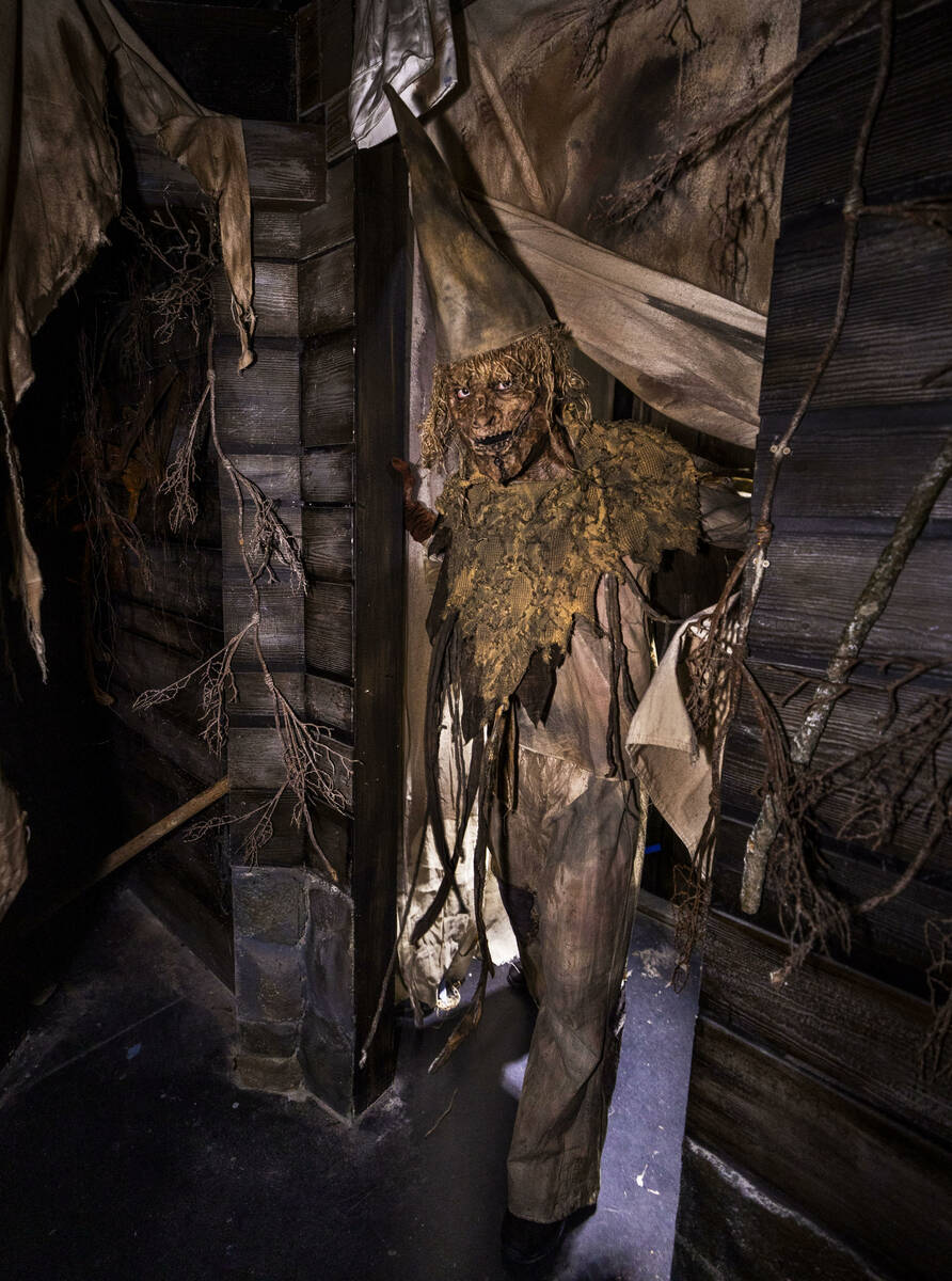 A scarecrow come to life appears in a doorway from Scarecrow: The Reaping, one of four haunted ...