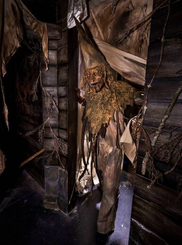A scarecrow come to life appears in a doorway from Scarecrow: The Reaping, one of four haunted ...
