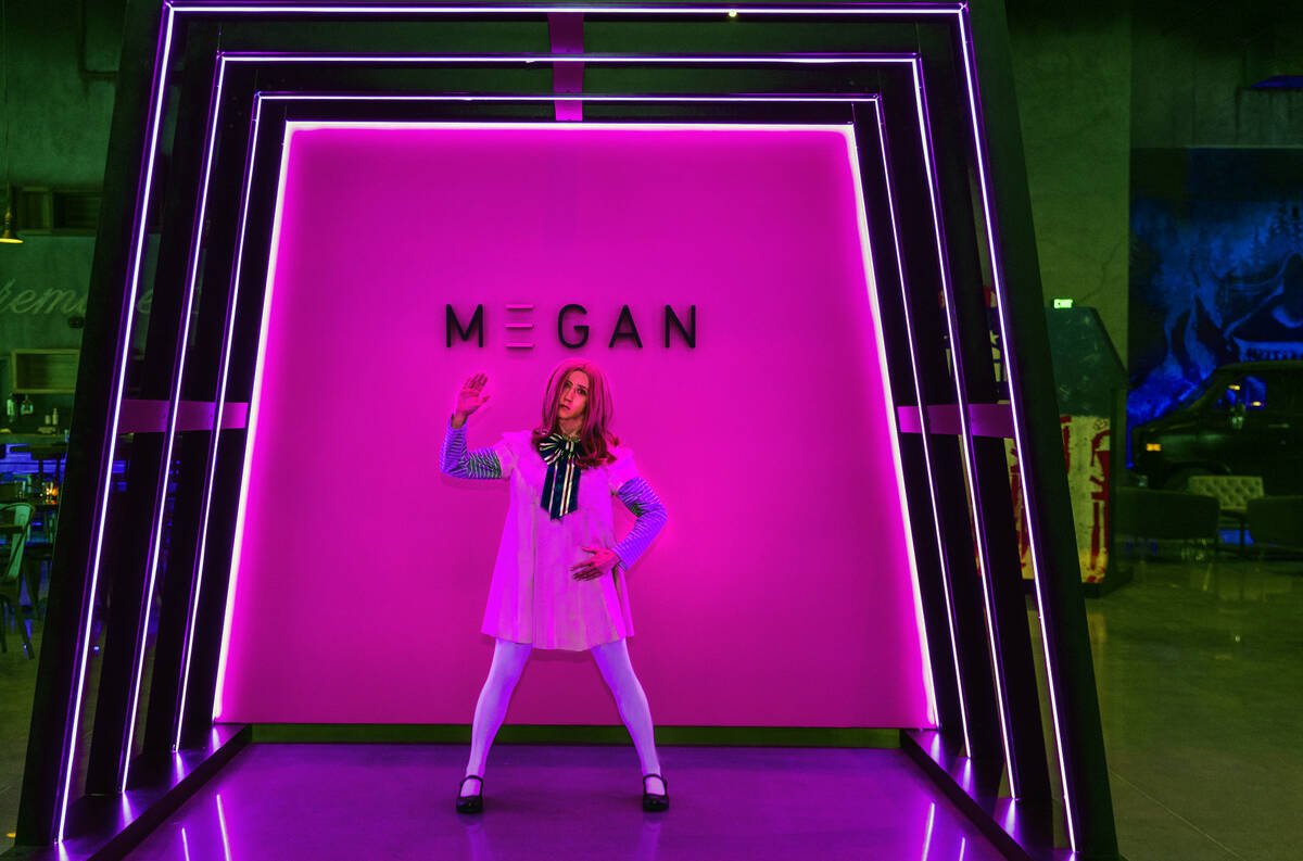 A Megan doll performs in a display within the dining area during a first look tour at Universal ...