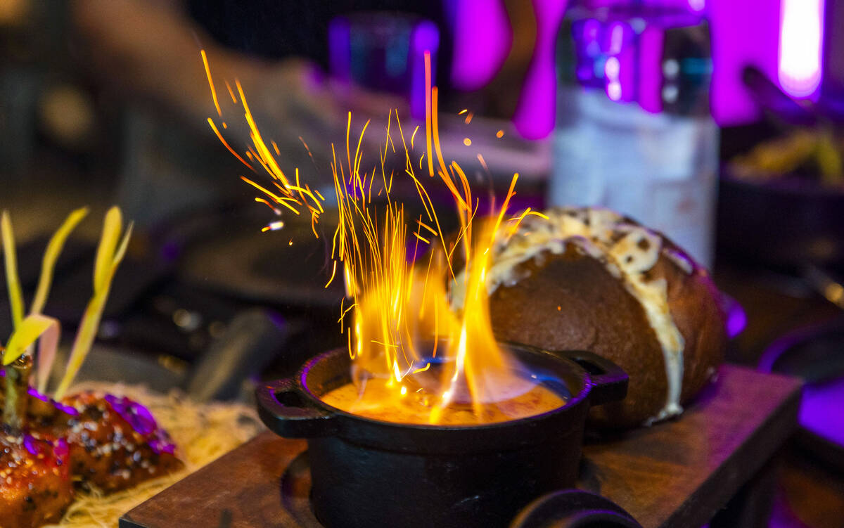 Broiler Bread with flaming cheese sauce is on the menu from the Premiere House restaurant durin ...