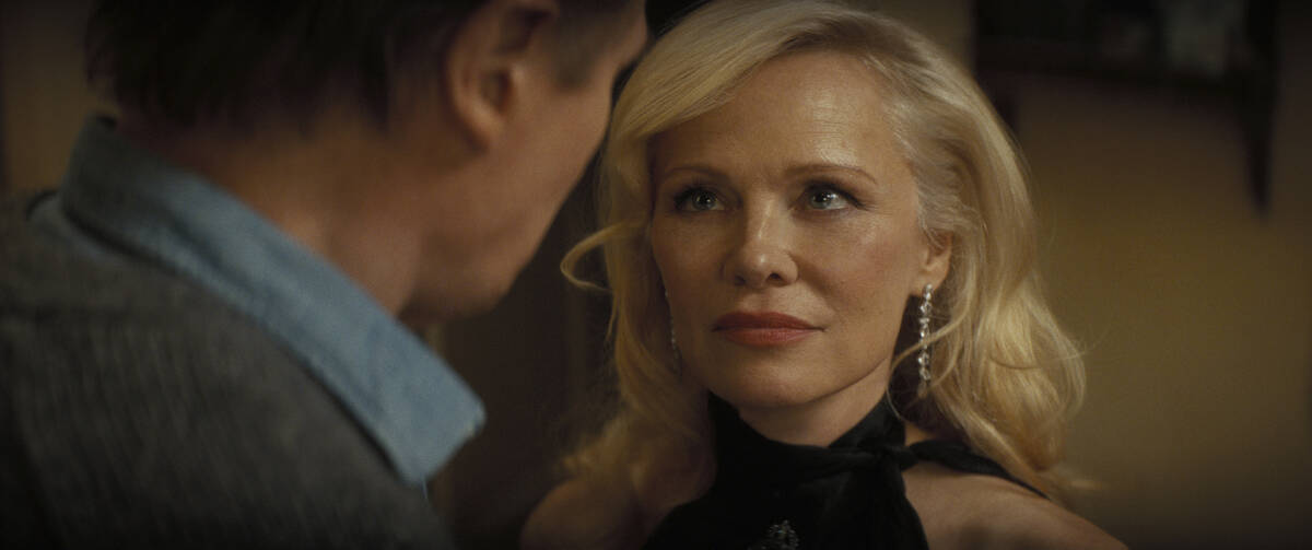 This image released by Paramount Pictures shows Pamela Anderson, right, and Liam Neeson in a sc ...