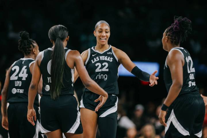 Aces center A'ja Wilson (22) celebrates with her teammates during a WNBA game between the Aces ...