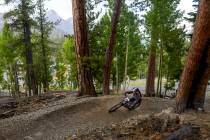 Woman's open rider Renee Shimada navigates a banked turn during the Viva La Gravity four-p ...