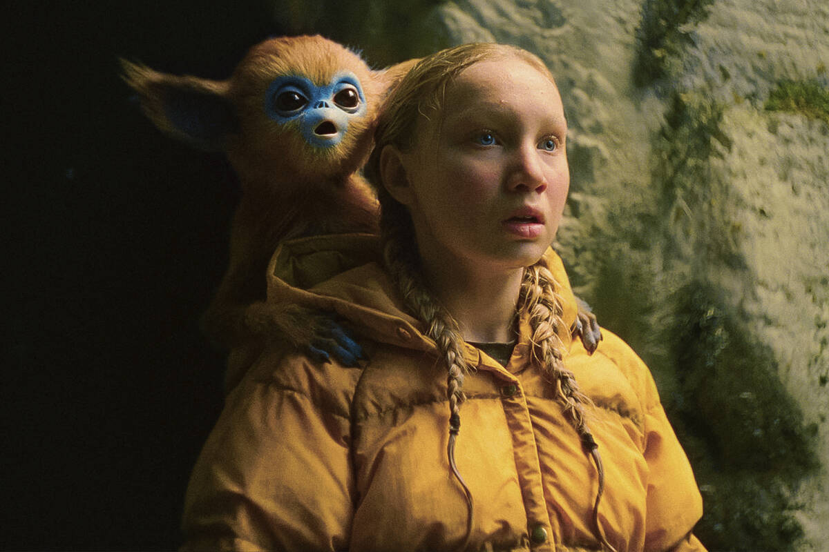 This image released by A24 shows Helena Zengel in a scene from "The Legend of Ochi." (A24 Films)