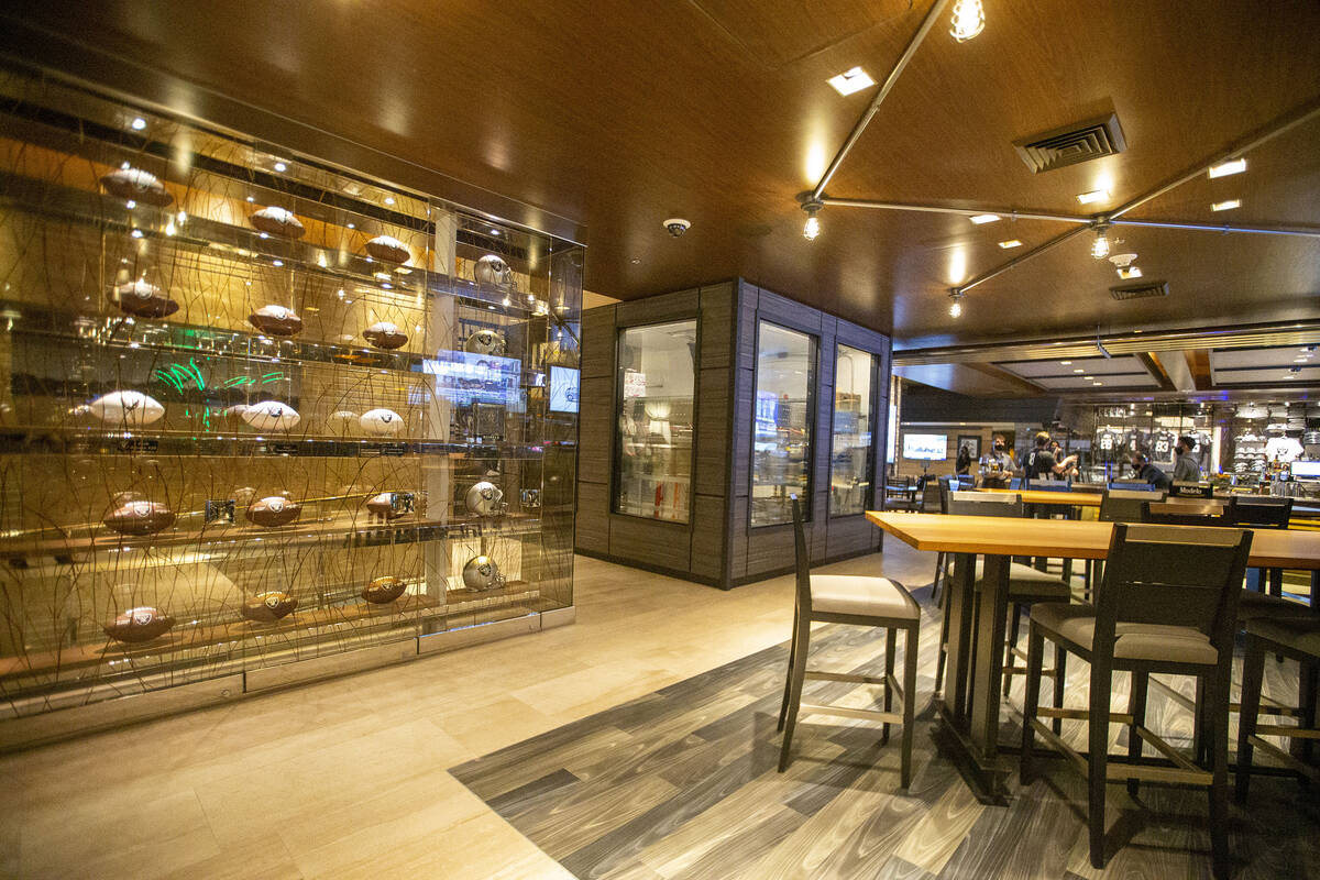 Raiders memorabilia on display at the Raiders Tavern and Grill at M Resort on Wednesday, March ...