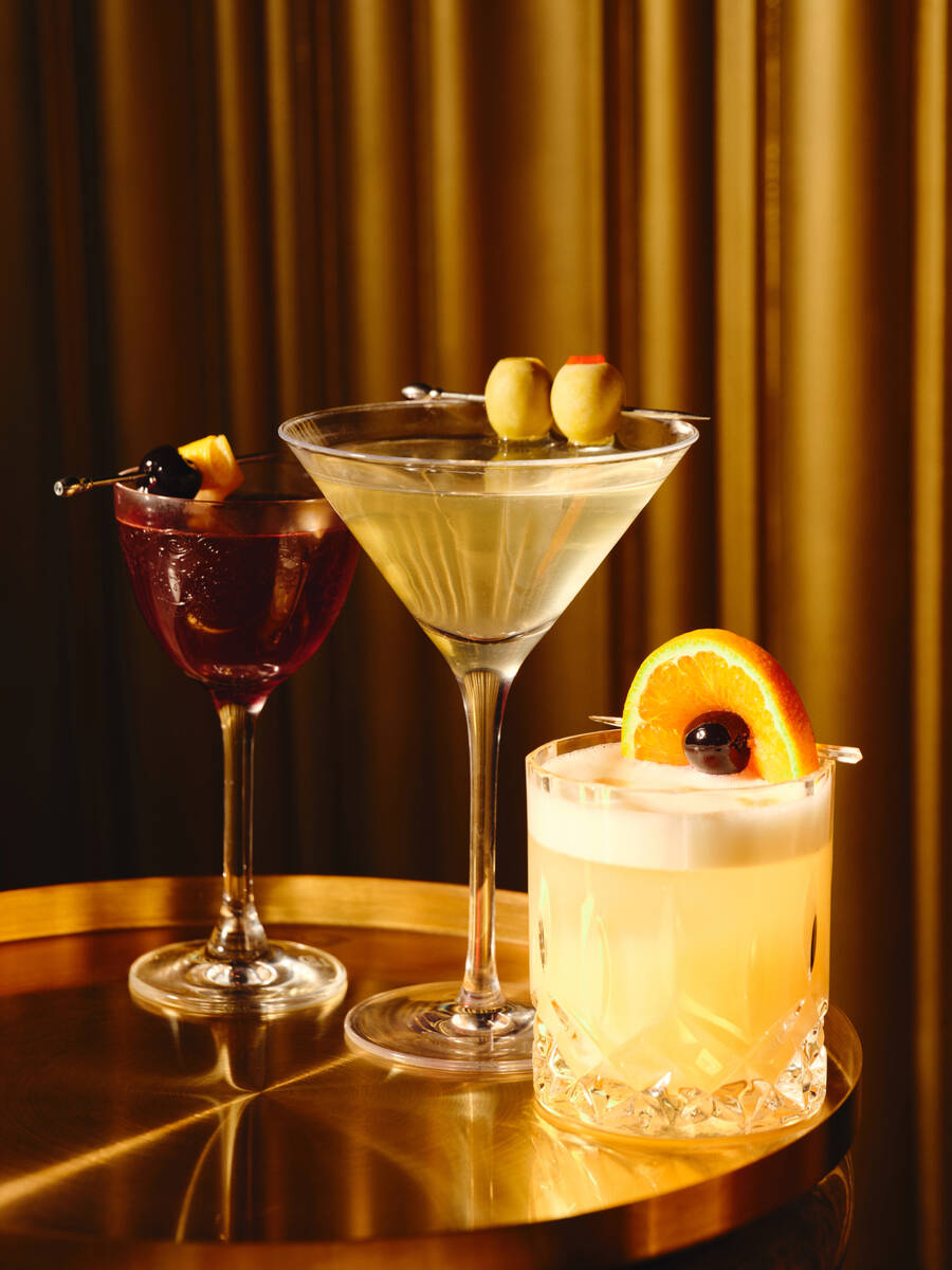 A manhattan, a dirty martini and a whiskey sour from Clique Bar & Lounge in The Cosmopolitan o ...