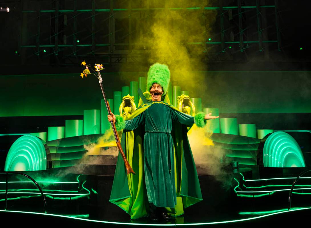 A performer addresses the crowd during a rehearsal of the atrium pre-show as part of "The ...