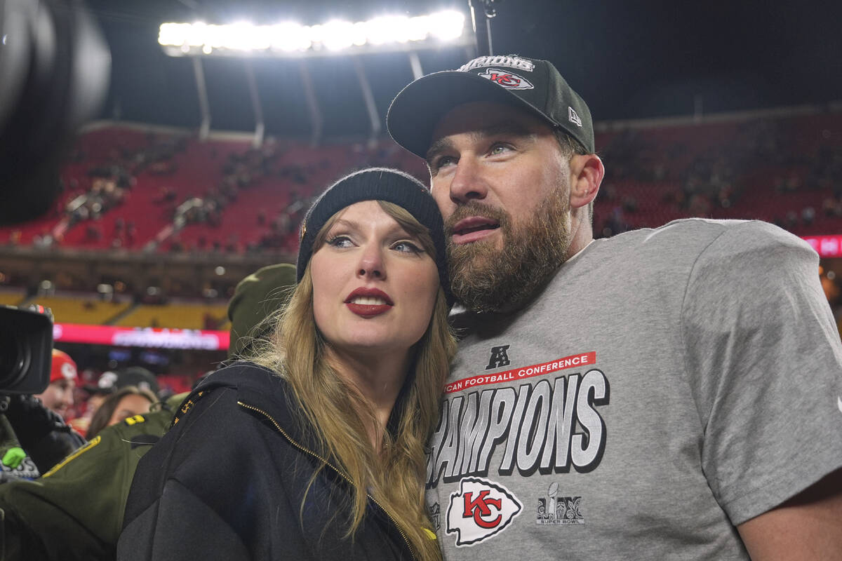 FILE - Kansas City Chiefs tight end Travis Kelce, right, appears with singer Taylor Swift after ...