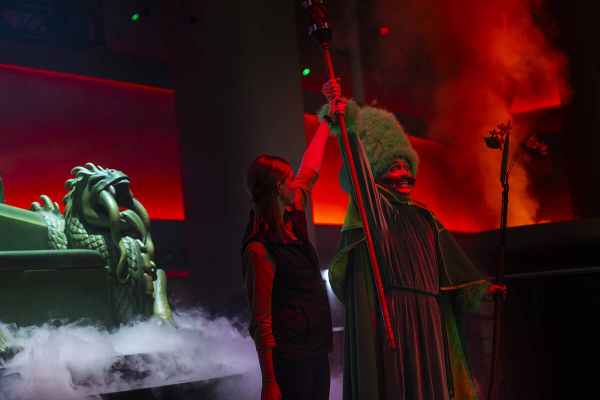 A performer brings a member of the audience to the stage during a rehearsal of the atrium pre-s ...