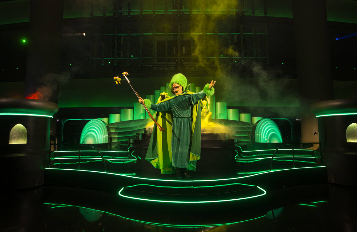 A performer addresses the crowd during a rehearsal of the atrium pre-show as part of "The ...