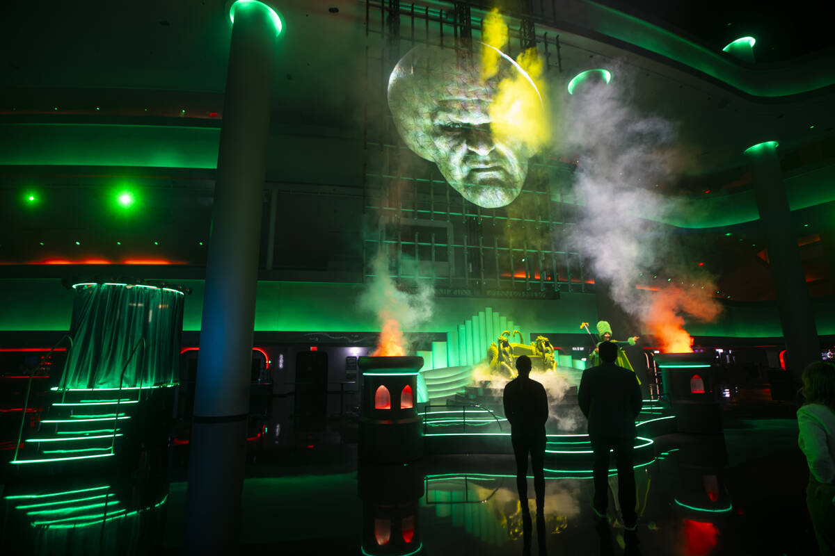 People watch a rehearsal of the atrium pre-show as part of "The Wizard of Oz" experie ...