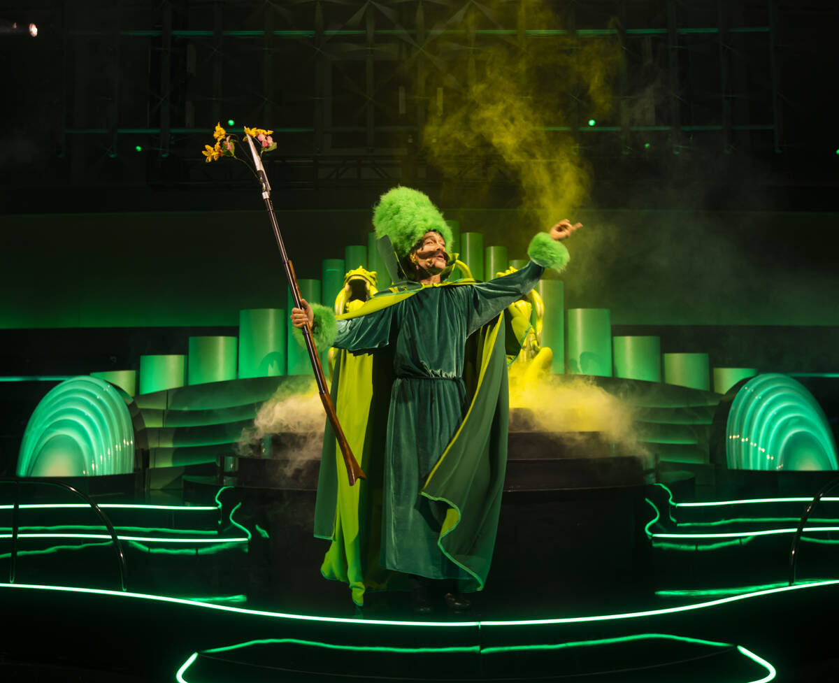 A performer addresses the crowd during a rehearsal of the atrium pre-show as part of "The ...