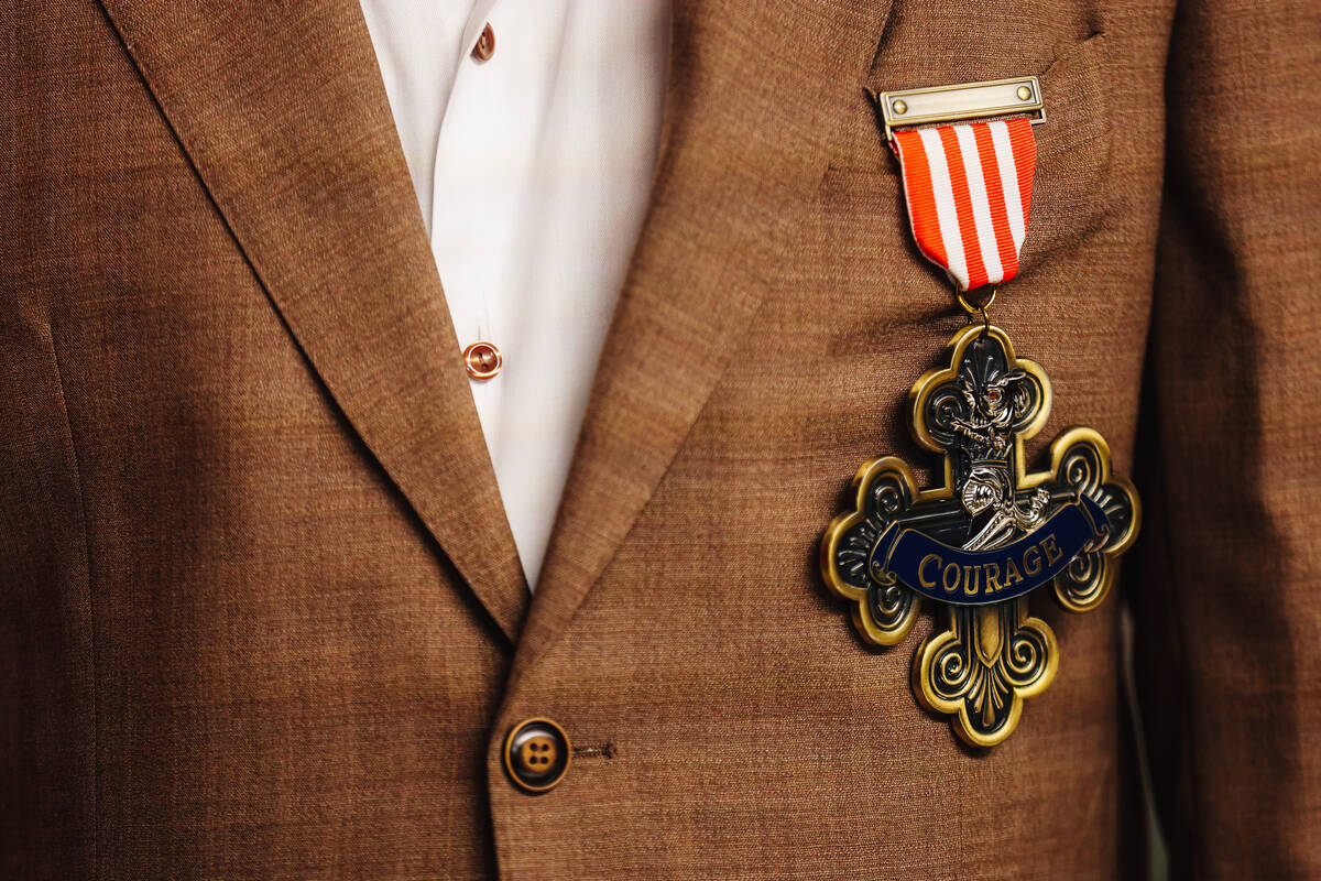 Glenn Derry, EVP of MSG Ventures, wears a badge of courage on a red carpet at the world premier ...