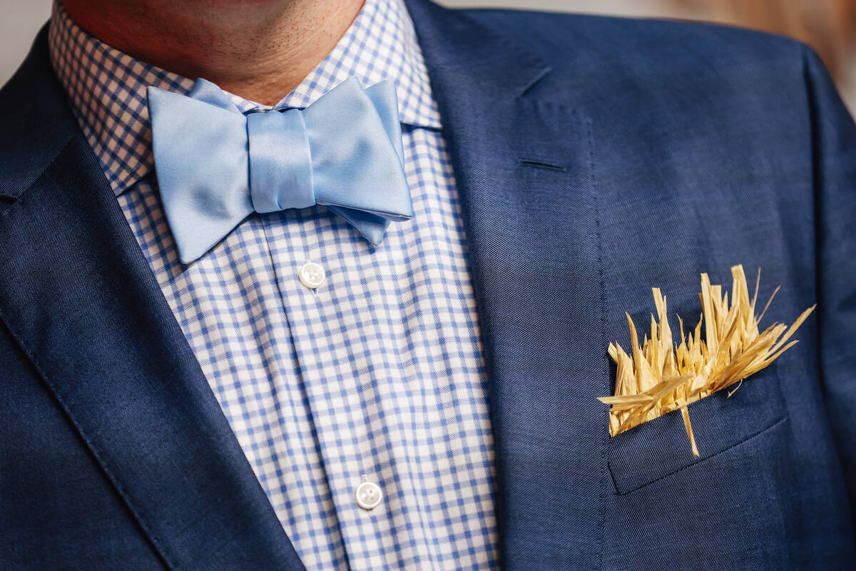 Hay sticks out of a suit pocket on a red carpet at the world premiere of “Wizard of Oz&# ...