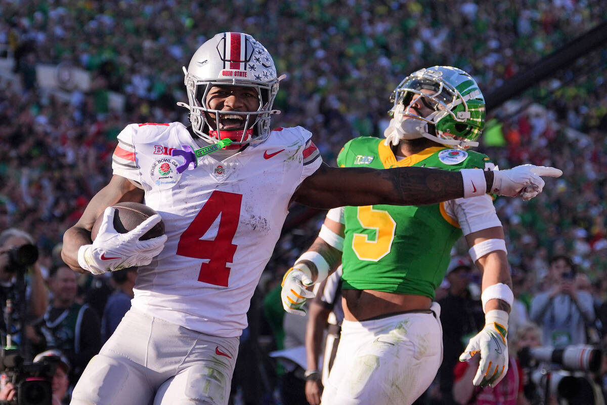 FILE - Ohio State wide receiver Jeremiah Smith (4) scores a touchdown against Oregon defensive ...
