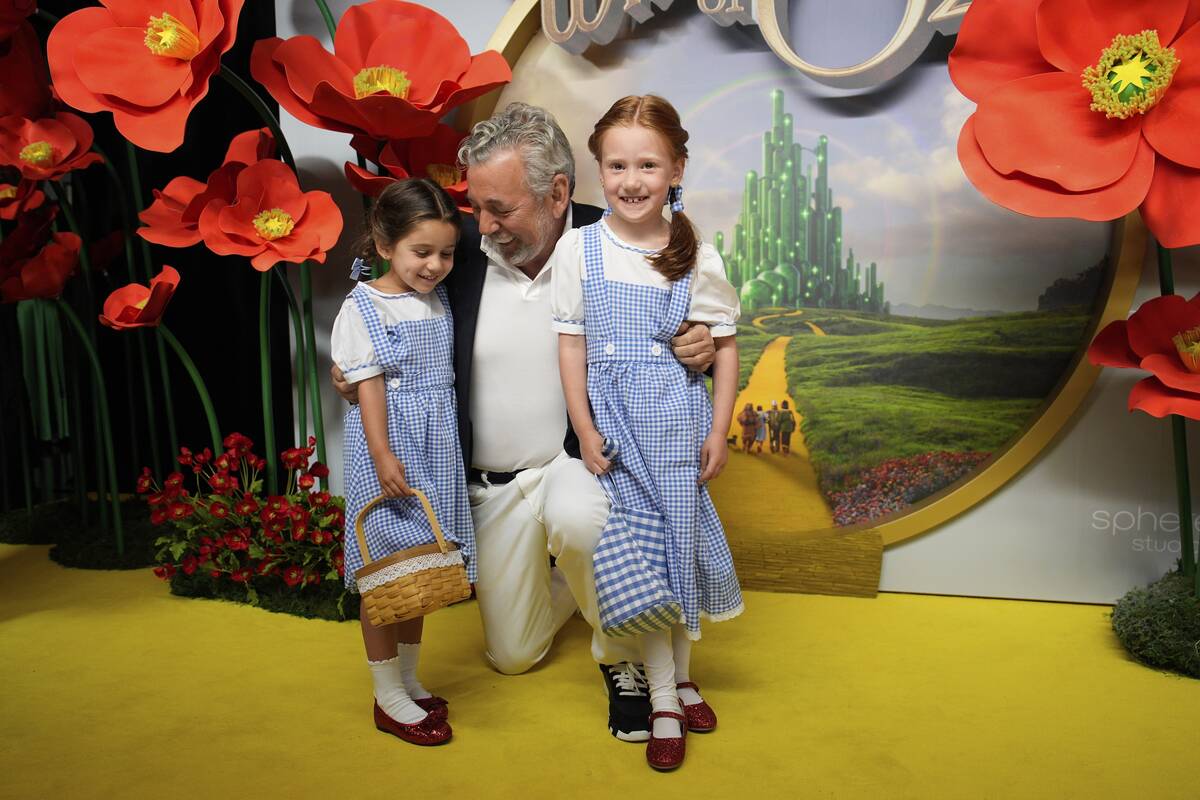James Dolan, executive chairman and CEO of Sphere Entertainment, center, poses with his grandda ...