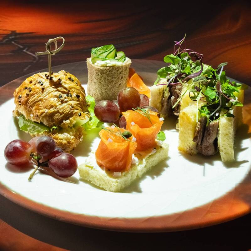 Tea sandwiches from the Teatime in Wonderland experience, inspired by "Alice in Wonderland," at ...