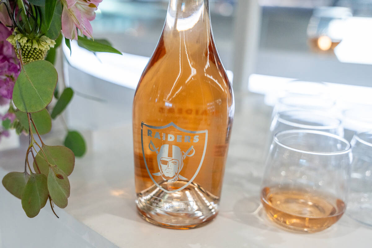 Bottles of Raiders Rosé are displayed on a branded cart at Allegiant Stadium in Las Vegas ...