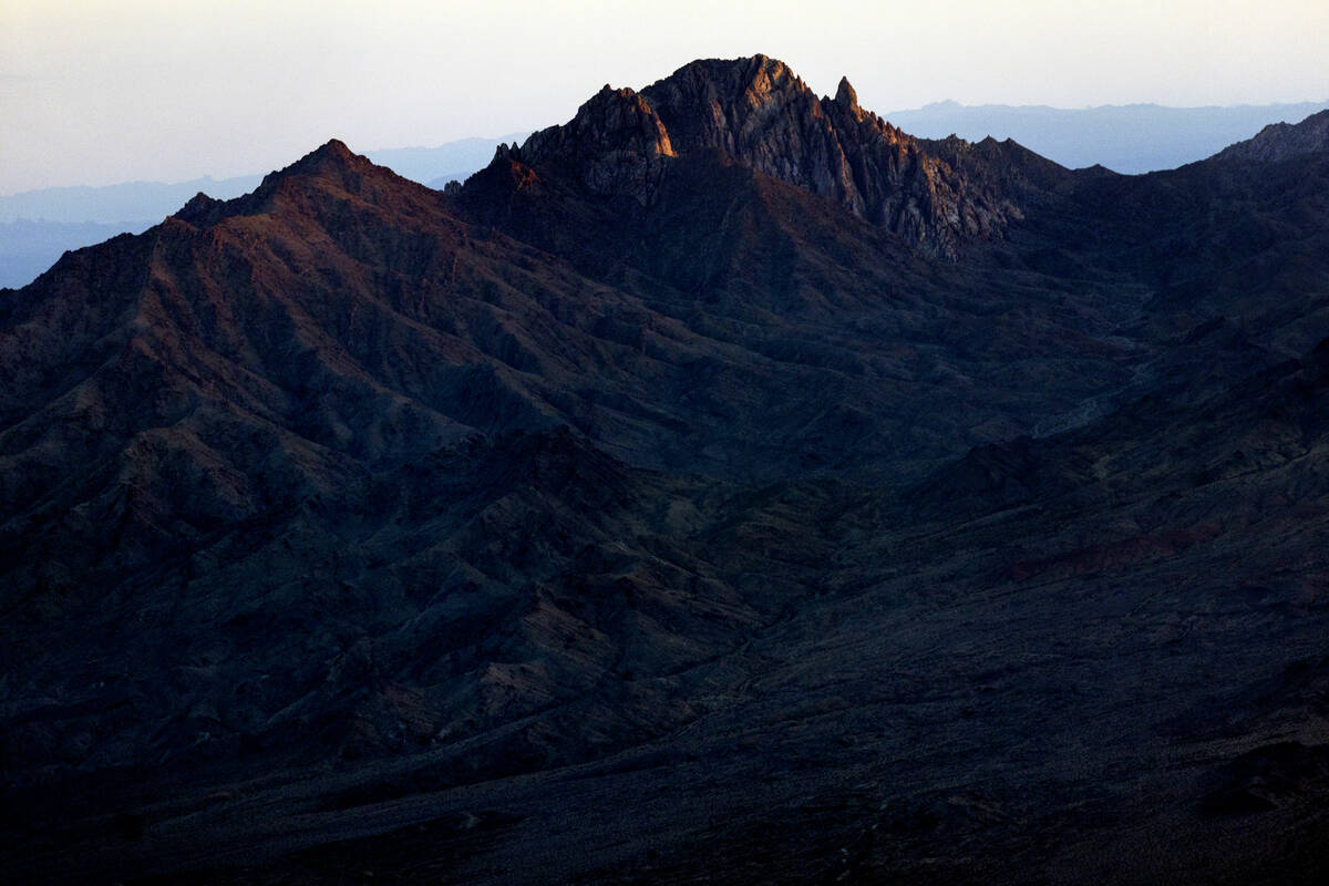 Light etches the peak of Spirit Mountain as sunset moves in about the proposed Avi Kwa Ame Nati ...