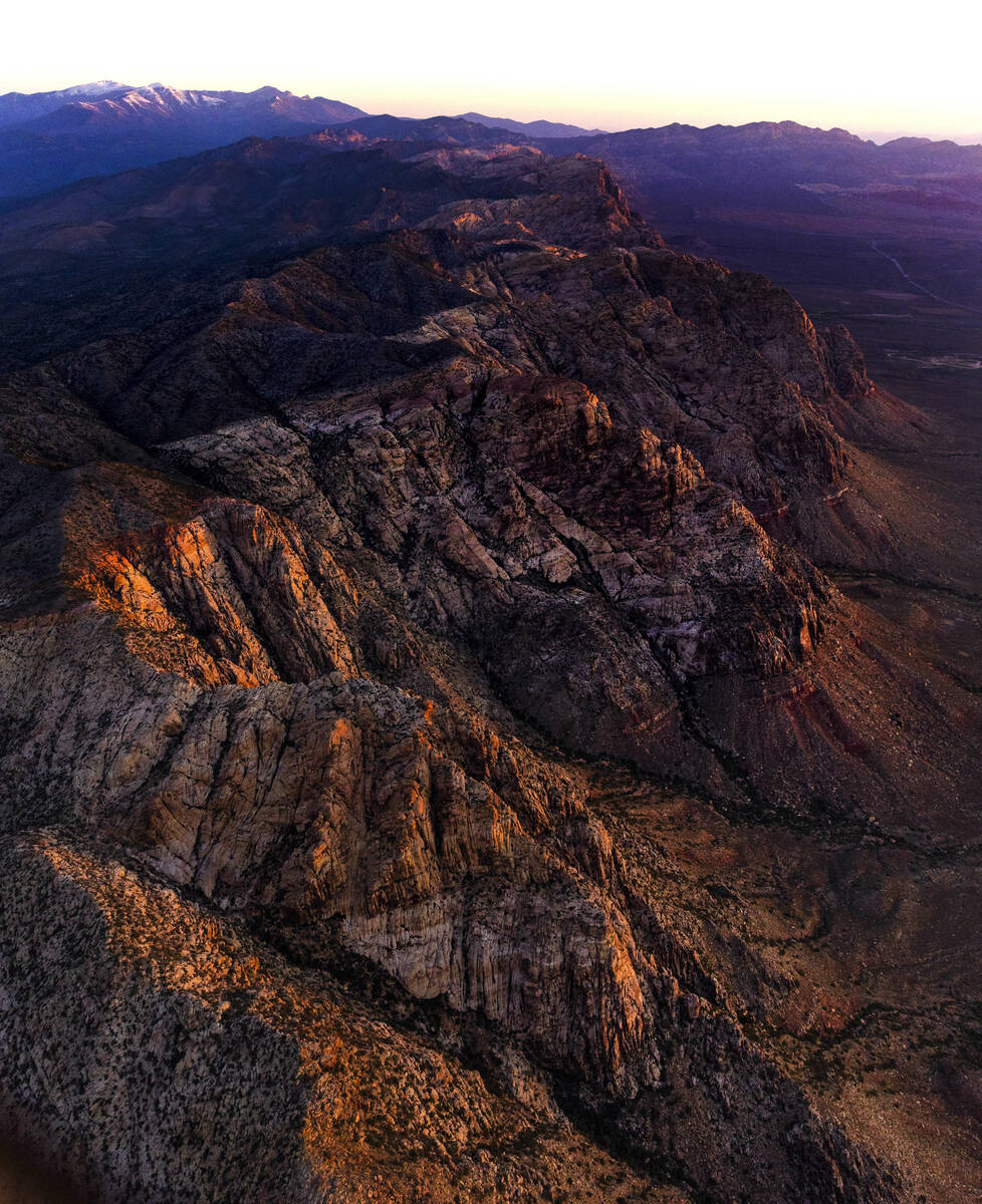 The Spring Mountains range catches the early morning light about the Red Rock Canyon National C ...
