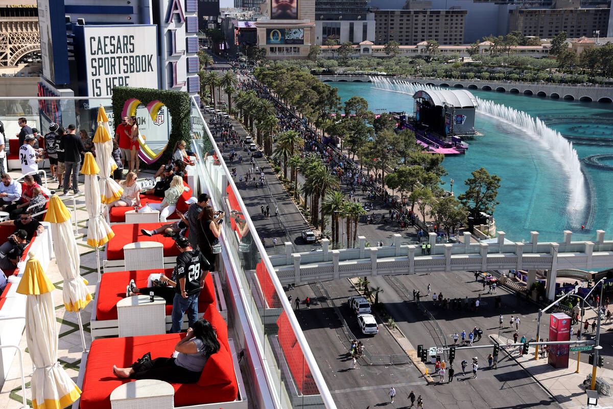 Fans mingle during a watch party at Drai’s Nightclub on the Strip in Las Vegas on Day 1 ...