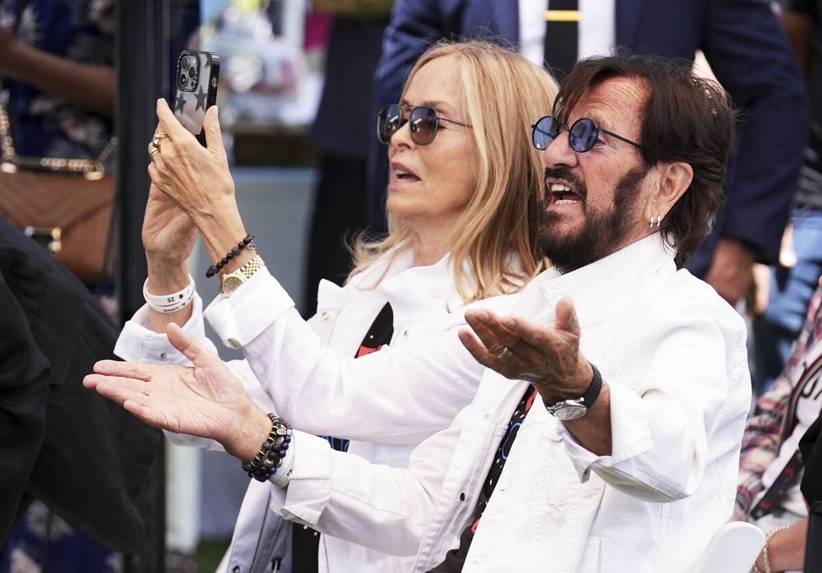 Ringo Starr, right, and his wife Barbara Bach watch performers at his 85th birthday celebration ...