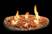 The 20-inch “Don’t Fear the Reaper” pie arrives at your table in flames. (Evel Pie)