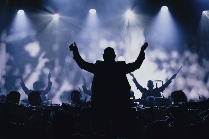 Symphony of Unity conductor Kevin Houben leads about 50 musicians, who infuse electronic tracks ...