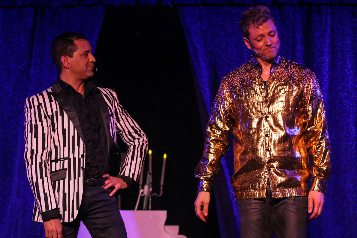 Raja (Rahman), left, and Jarrett (Parker) are shown in their "Magician vs. Maestro" show in Ap ...